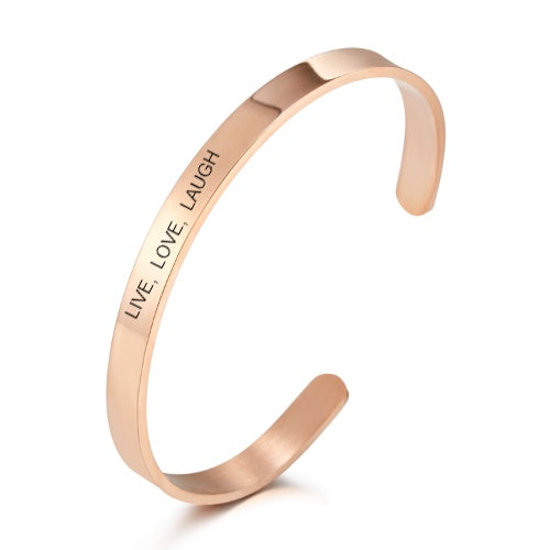 Rose gold bracelet with 'LIVE. LOVE. LAUGH' engraving on a white background