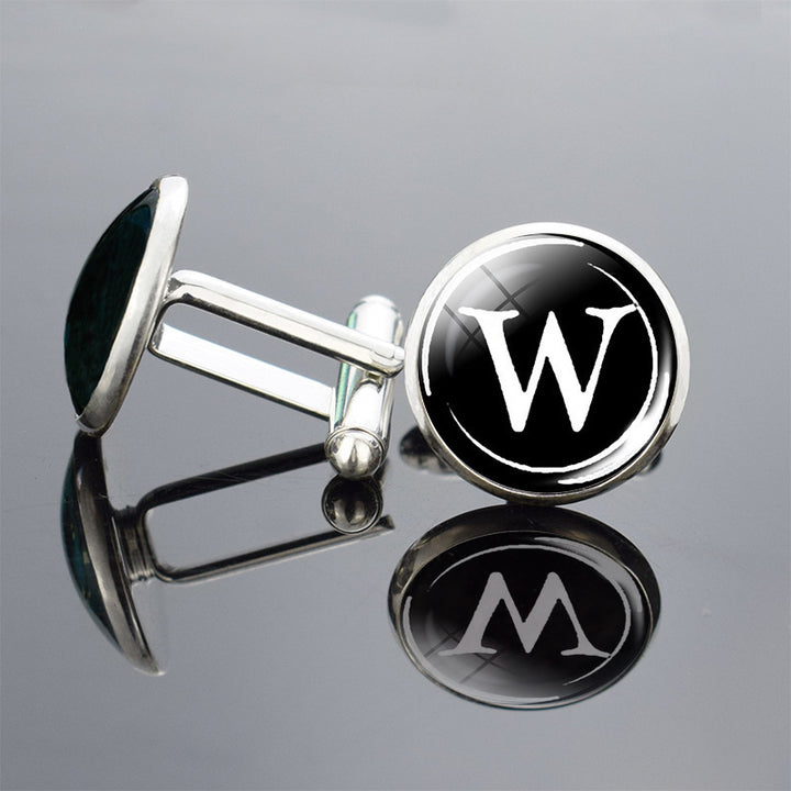 Cufflinks with a black circle and white letter &