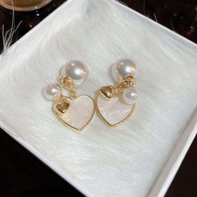 White Brushed Pearl heart Earrings on a white tray