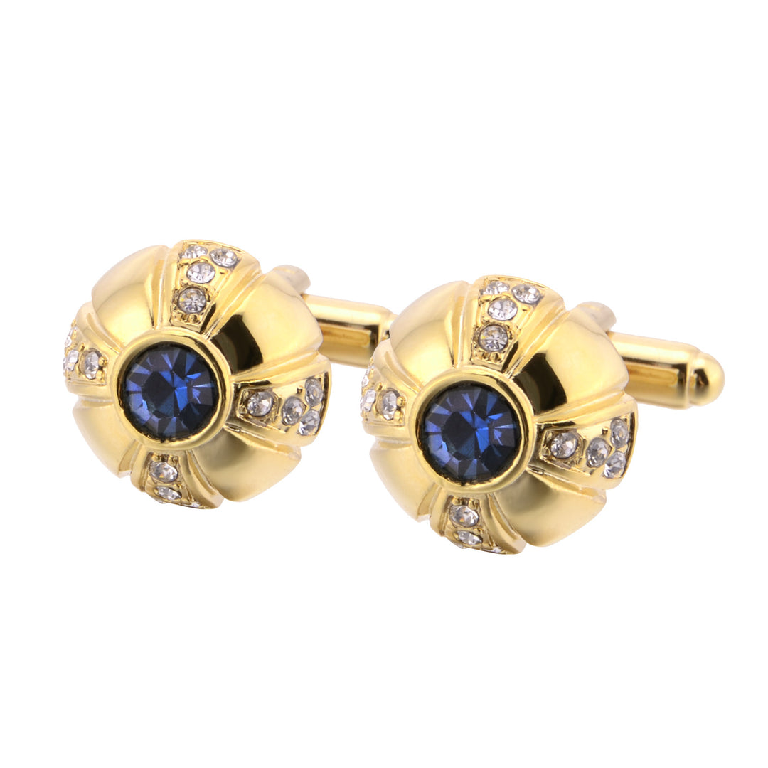 Gold cufflinks with blue gemstones and clear stones on a white background