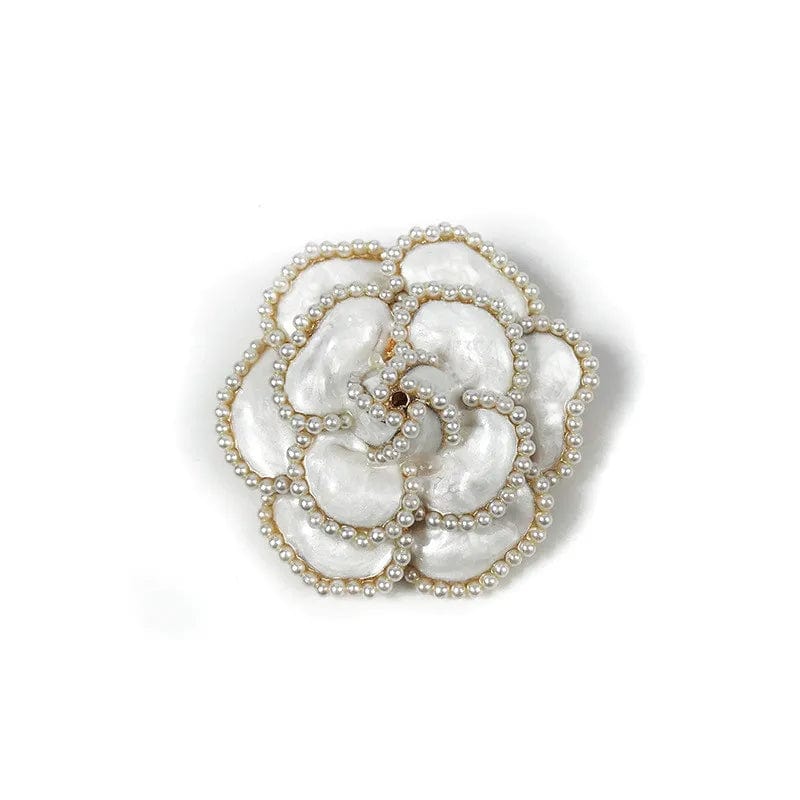 white camellia flowers pearl brooches on a white background