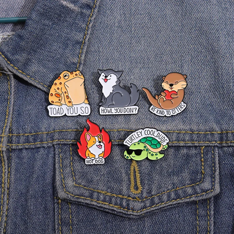 Set of cartoon-themed pins on a denim jacket