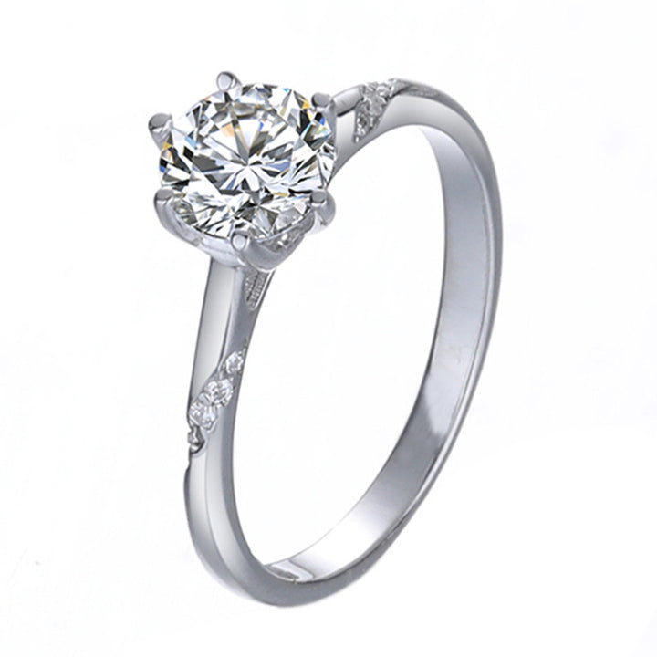 Silver ring with a large diamond on a white background