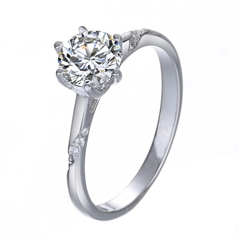 Silver ring with a large diamond on a white background