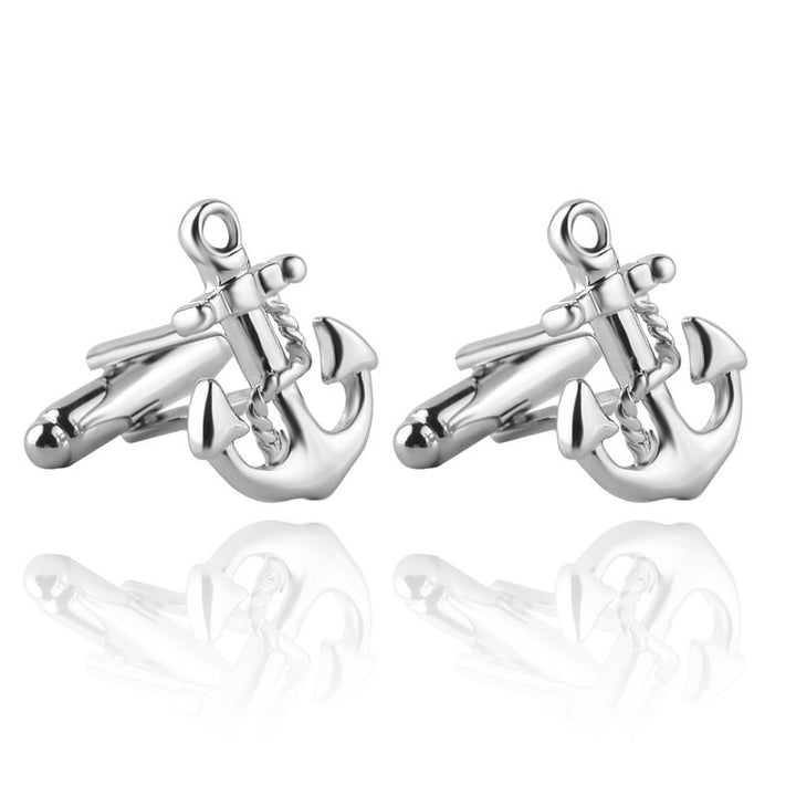 Silver anchor-shaped cufflinks on a white background