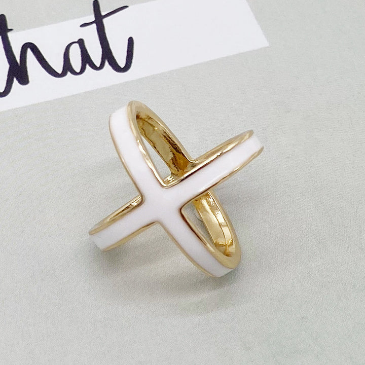 Gold and white ring on a light gray background with &