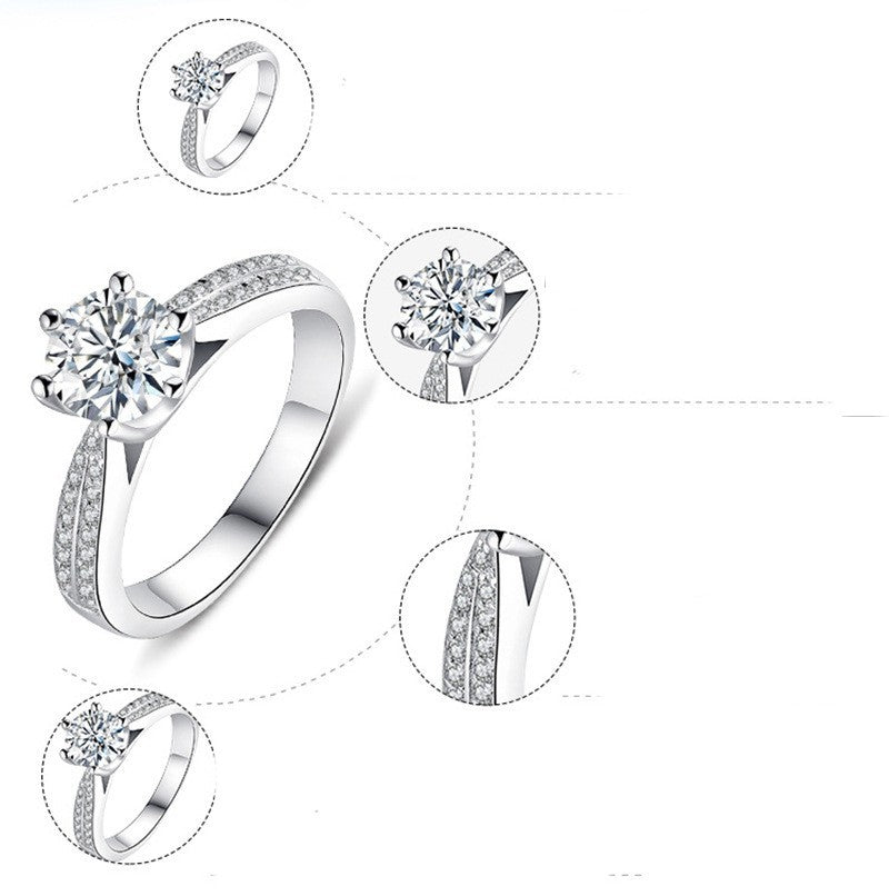 Silver ring with diamond-like gemstones on a white background