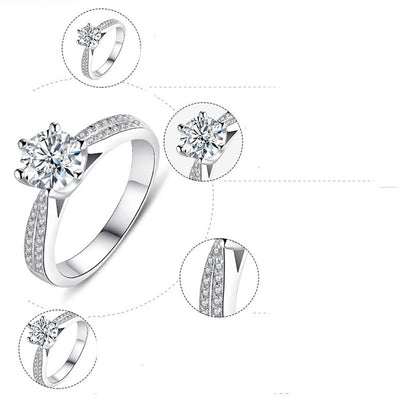 Silver ring with diamond-like gemstones on a white background