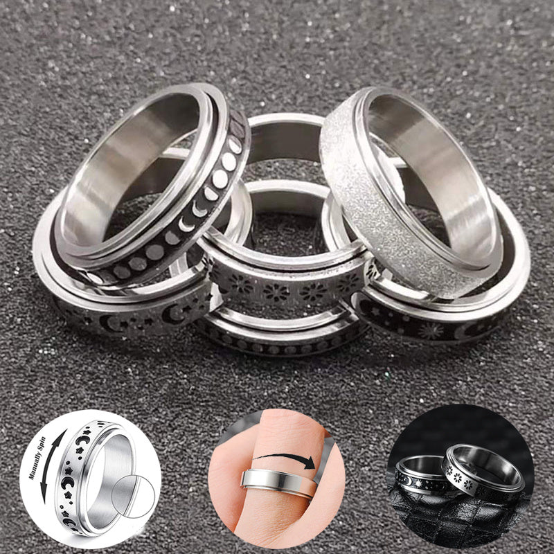 Set of metallic rings with different designs on a dark surface and inserts of some samples