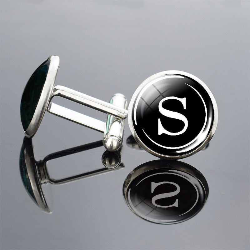 Cufflinks with a letter &