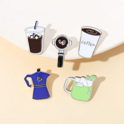 Set of coffee-themed pins on a beige background