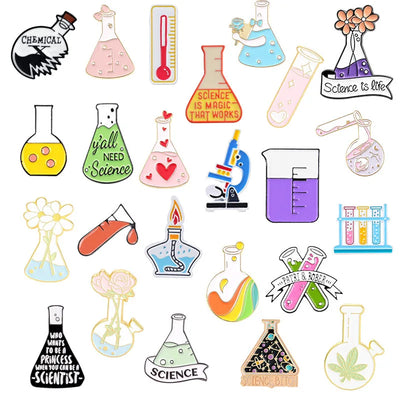 Collection of colorful science-themed enamel pins on a white background