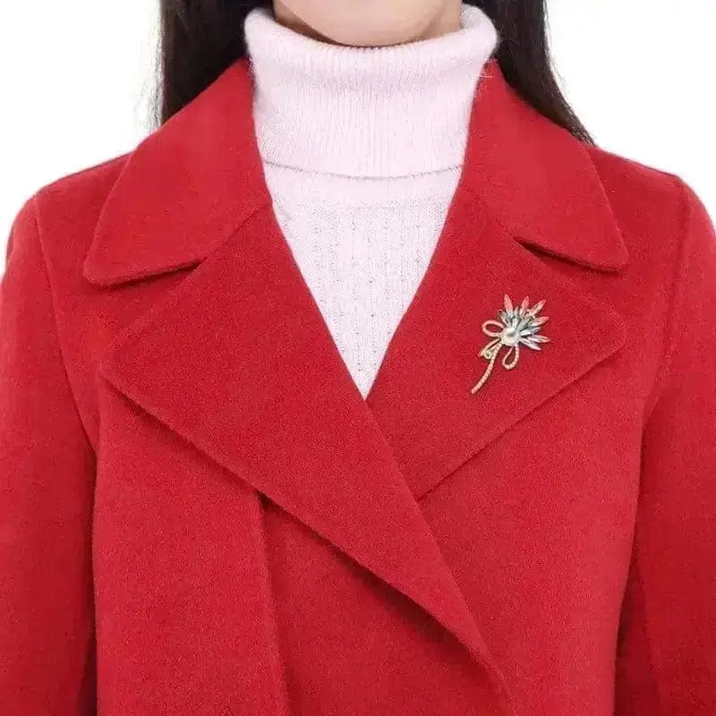 a woman wearing floral alloy brooch elegance on a red jacket