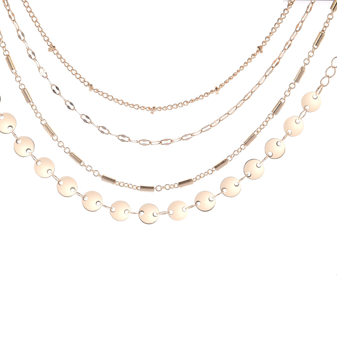 4 gold necklaces on a white background
