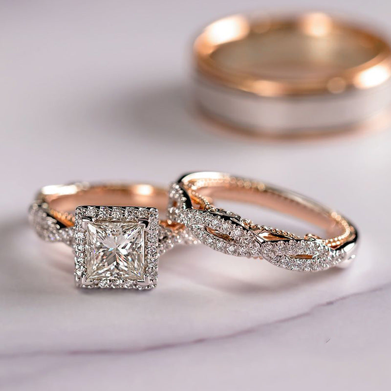 Two rose gold diamond rings on a light background