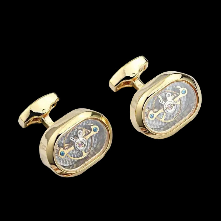 Gold cufflinks with intricate design on a white surface