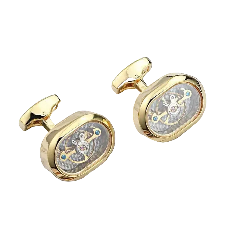 Gold cufflinks with intricate design on a black background
