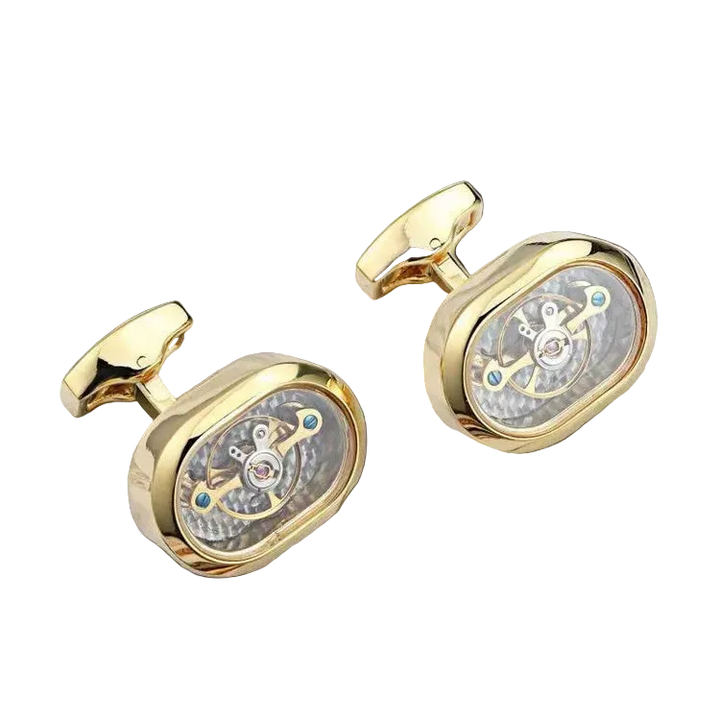 Gold cufflinks with intricate design on a black background