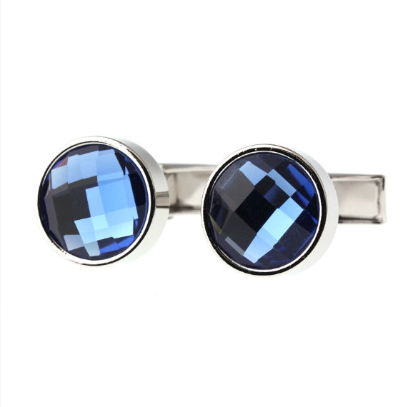 Cufflinks with blue gemstones on a white background
