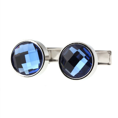 Cufflinks with blue gemstones on a white background