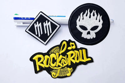 Three patches with different designs on a white background