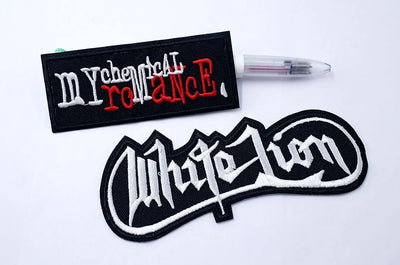 Two embroidered patches with text on a white background