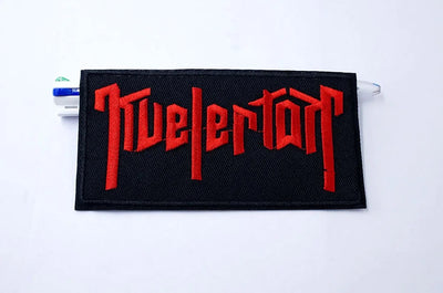 Black patch with red 'Nivelerton' text on a white background