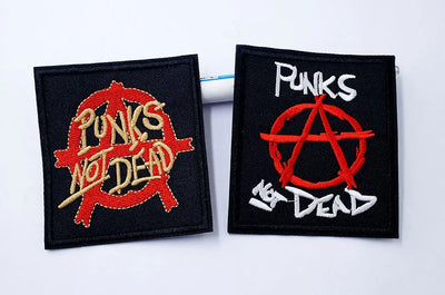 Two patches with 'Punks Not Dead' design on a white background