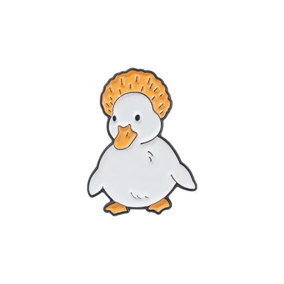 enamel pin of a Cartoon duck with a crown on a white background