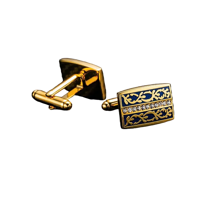 Gold and blue cufflinks on a carbon fiber background