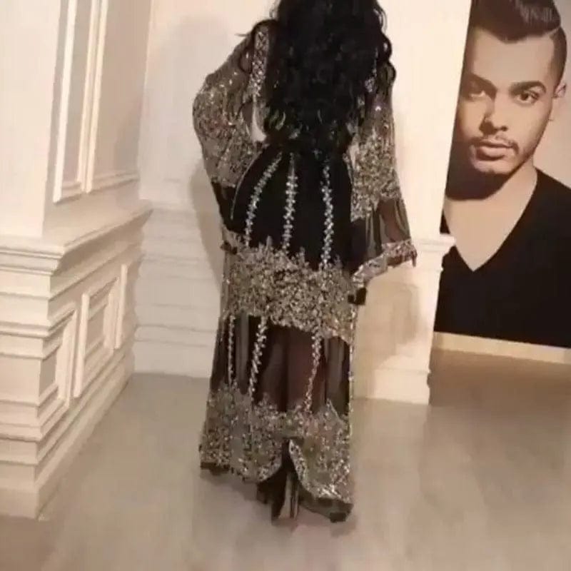 a woman wearing Bronzing sexy long skirt shawl back view