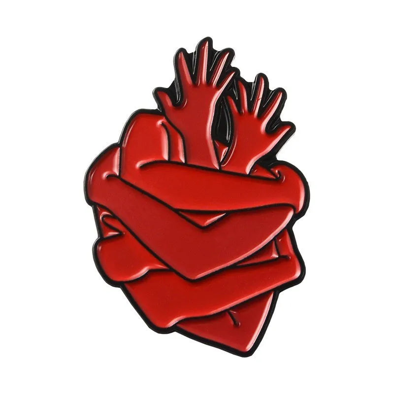 enamel pin in Red heart-shaped badge with hands on a white background