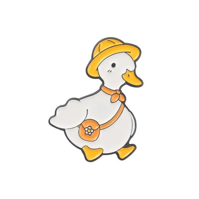 enamel pin of a Cartoon duck wearing a yellow hat and orange bag on a white background