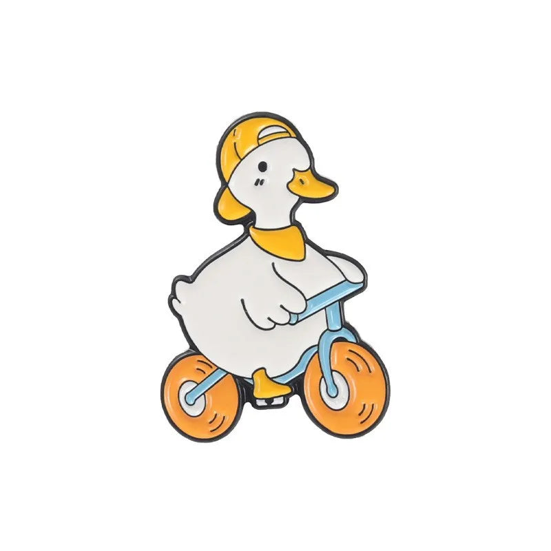 enamel pin of a Cartoon duck riding a bike on a white background