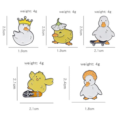 enamel pins of cartoon ducks with their sizes and weights on a white background