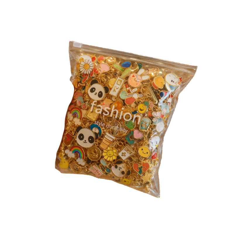 Hand holding a package of colorful fashion accessories with panda designs on a white background