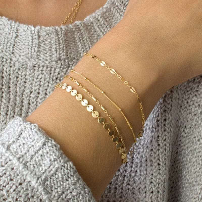 BROOCHITON Bracelets  a woman wearing 4-piece bracelet set in her right wrist