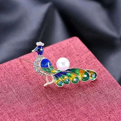 peacock zircon animal brooch Blue Green on a pink canvas