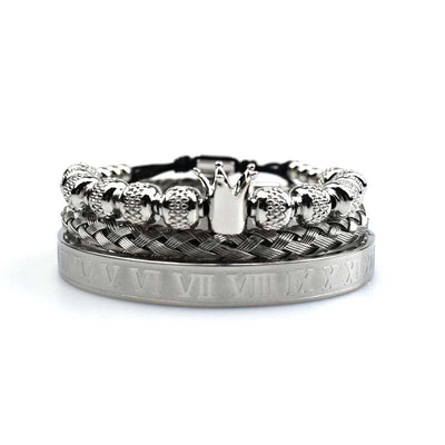 Silver bracelet with crown design on a white background