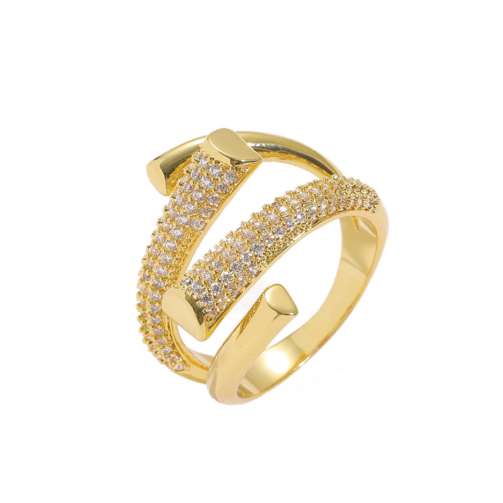 Gold ring with Zircon accents on a white background