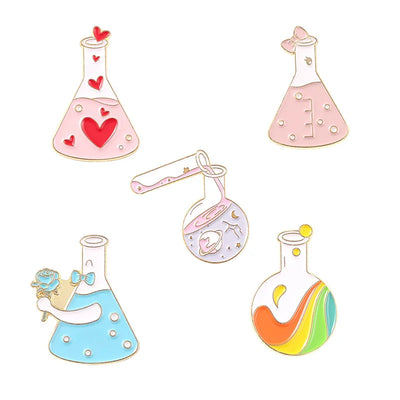 Set of colorful science-themed pins on a white background
