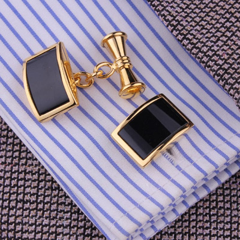 black and gold Cufflinks on striped light blue and white shirt