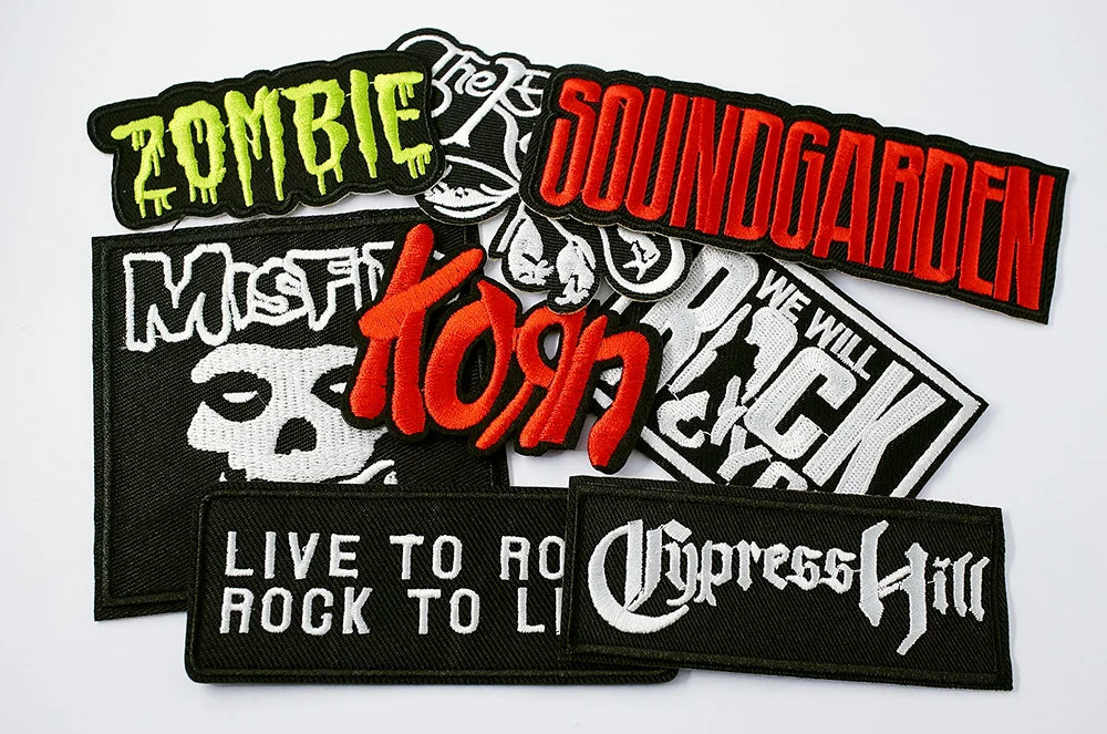 Collection of music band patches including Zombie, Soundgarden, Misfits, Korn, We Will Rock Us, and Cypress Hill on a white background.