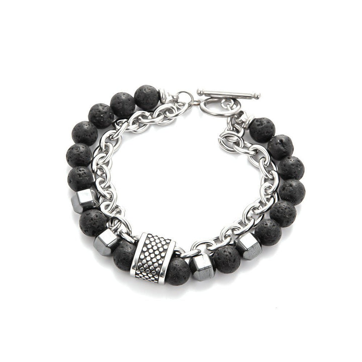 close up Bracelet with black beads and silver chain on a white surface