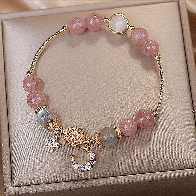 BROOCHITON Bracelets Natural Stone Star And Moon Strawberry Crystal Bracelet for Women top view in a jewelry box