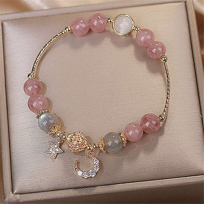 BROOCHITON Bracelets Natural Stone Star And Moon Strawberry Crystal Bracelet for Women top view in a jewelry box