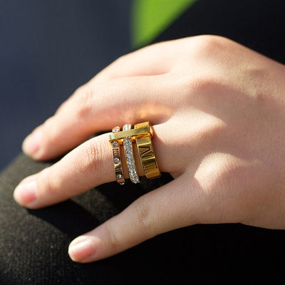 a woman wearing Ring in left ring finger