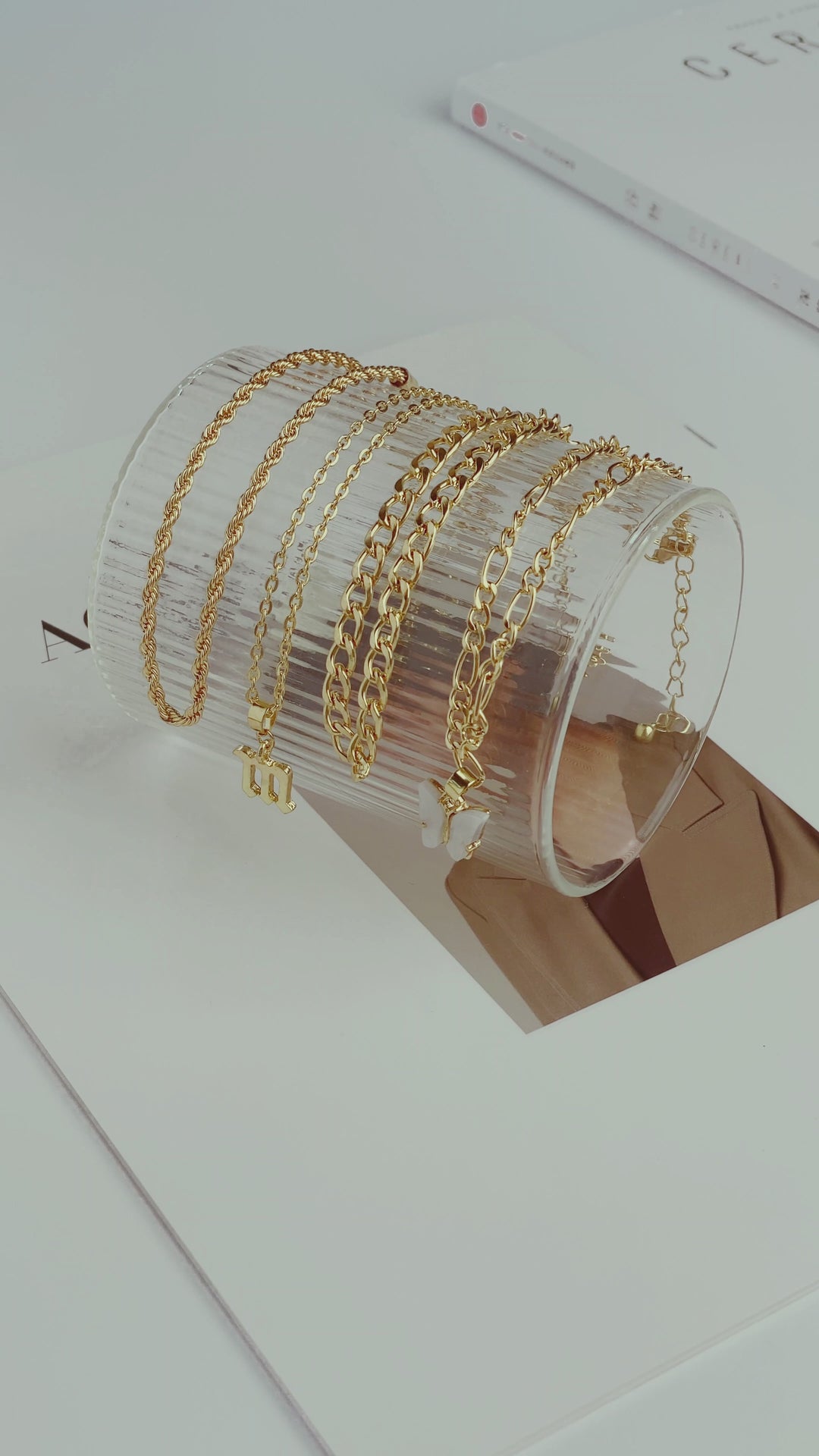 video of Set of four gold anklets with  charms 