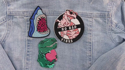 Video of a Collection of colorful patches with various designs on a denim background