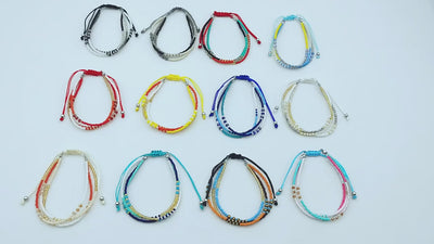 Video of Colorful beaded bracelets on a light blue bakground